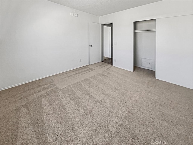 8800 Cedros Ave Unit 209, Panorama City, CA 91402 - unfurnished bedroom featuring a closet, a textured ceiling, and carpet