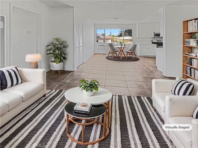 8800 Cedros Ave Unit 209, Panorama City, CA 91402 - living area featuring a textured ceiling and light tile patterned flooring