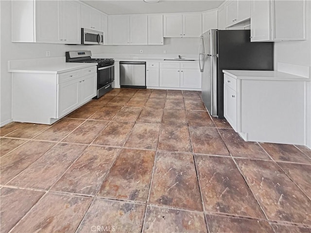 8800 Cedros Ave Unit 209, Panorama City, CA 91402 - kitchen with stainless steel appliances, white cabinets, and light countertops