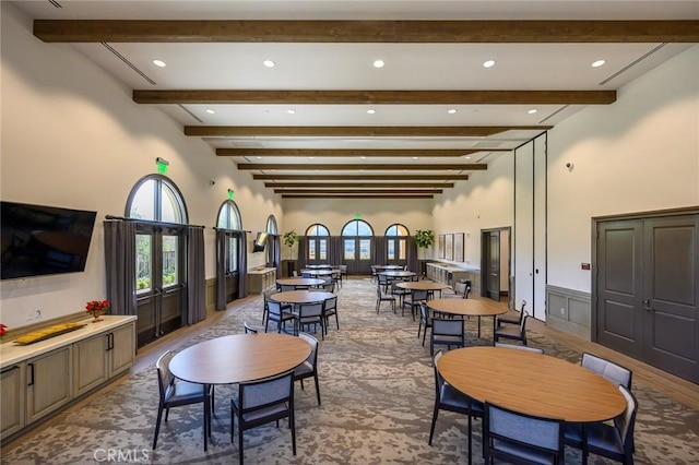 11537 Alton Dr, Corona, CA 92883 - dining space with beam ceiling, recessed lighting, french doors, a high ceiling, and a wainscoted wall