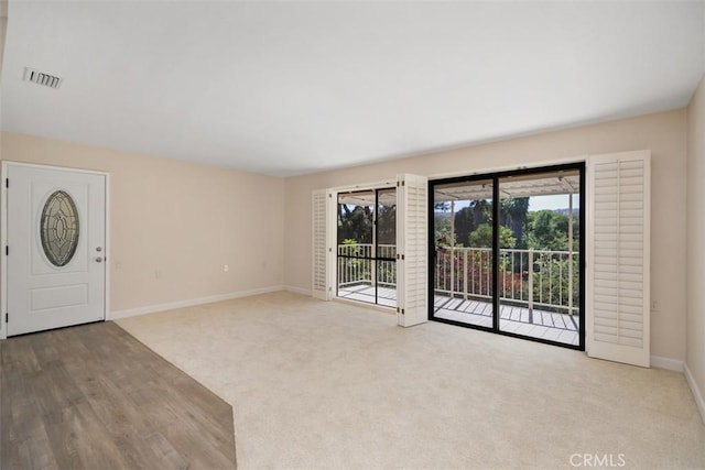 905 Ronda Sevilla Unit 0, Laguna Woods, CA 92637 - entrance foyer with carpet floors and wood finished floors
