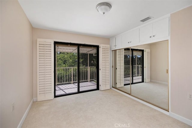 905 Ronda Sevilla Unit 0, Laguna Woods, CA 92637 - unfurnished bedroom featuring access to outside and carpet flooring