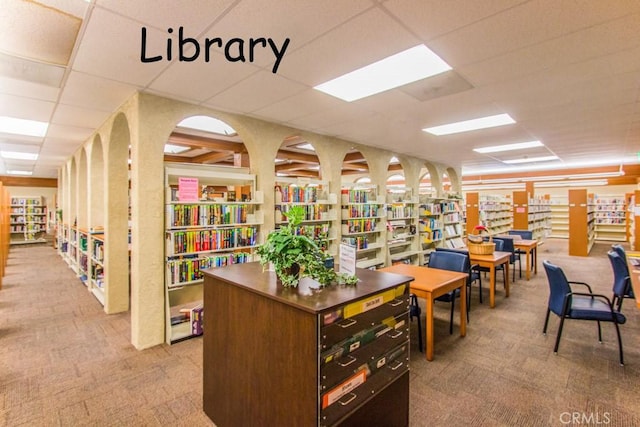 905 Ronda Sevilla Unit 0, Laguna Woods, CA 92637 - office space with carpet, a paneled ceiling, and wall of books