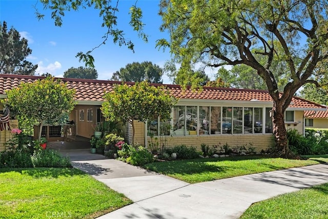 905 Ronda Sevilla Unit 0, Laguna Woods, CA 92637 - view of front of property featuring a front lawn and a tile roof