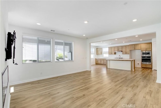 32210 Hillstone St, Temecula, CA 92591 - unfurnished living room featuring light wood-style floors and recessed lighting