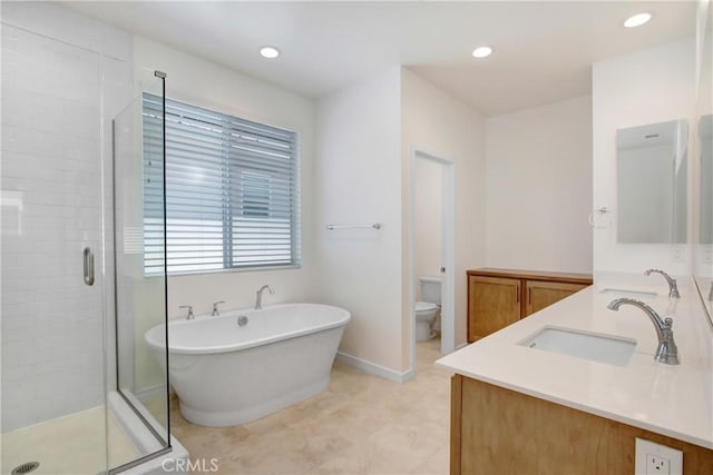 32210 Hillstone St, Temecula, CA 92591 - full bathroom with double vanity, a shower stall, a freestanding tub, and recessed lighting