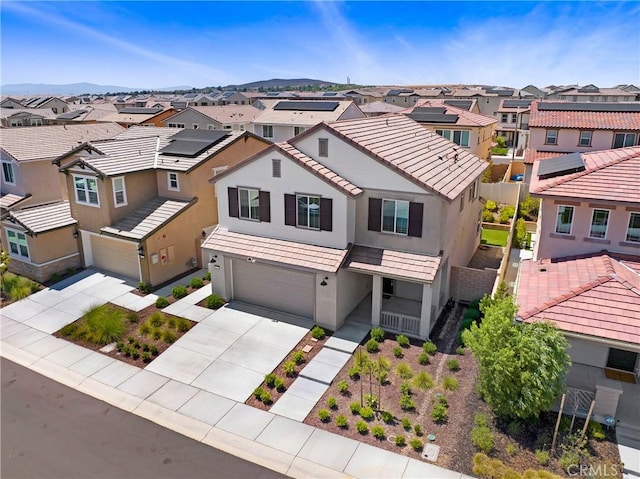 32210 Hillstone St, Temecula, CA 92591 - view of front of home with a residential view, an attached garage, a tiled roof, and driveway