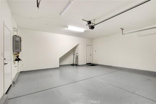 32210 Hillstone St, Temecula, CA 92591 - garage featuring a garage door opener and baseboards