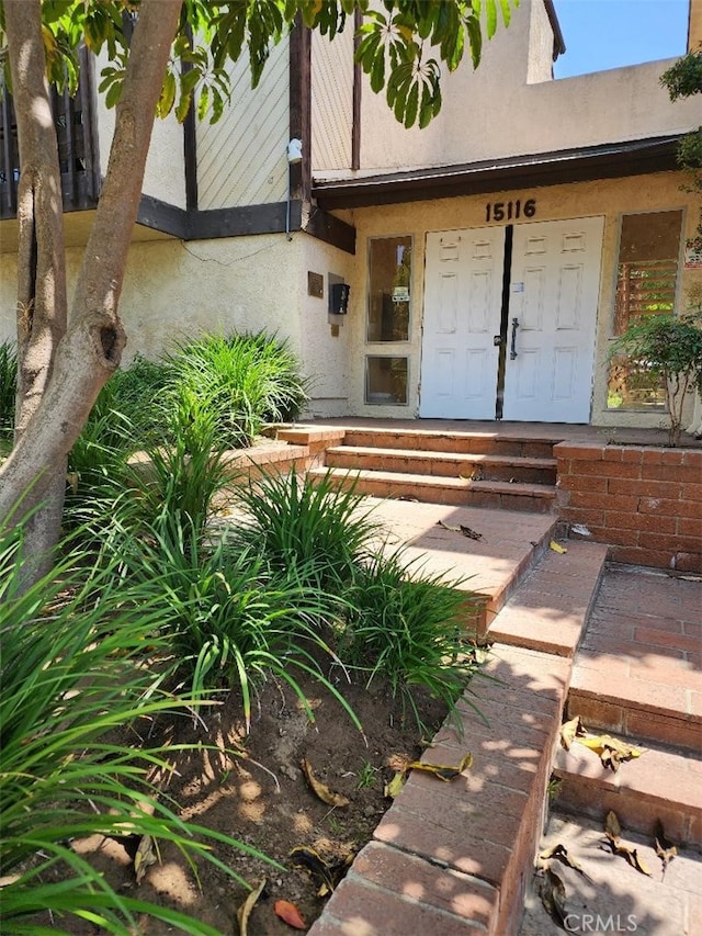15116 S Raymond Ave Unit 104, Gardena, CA 90247 - view of exterior entry with stucco siding