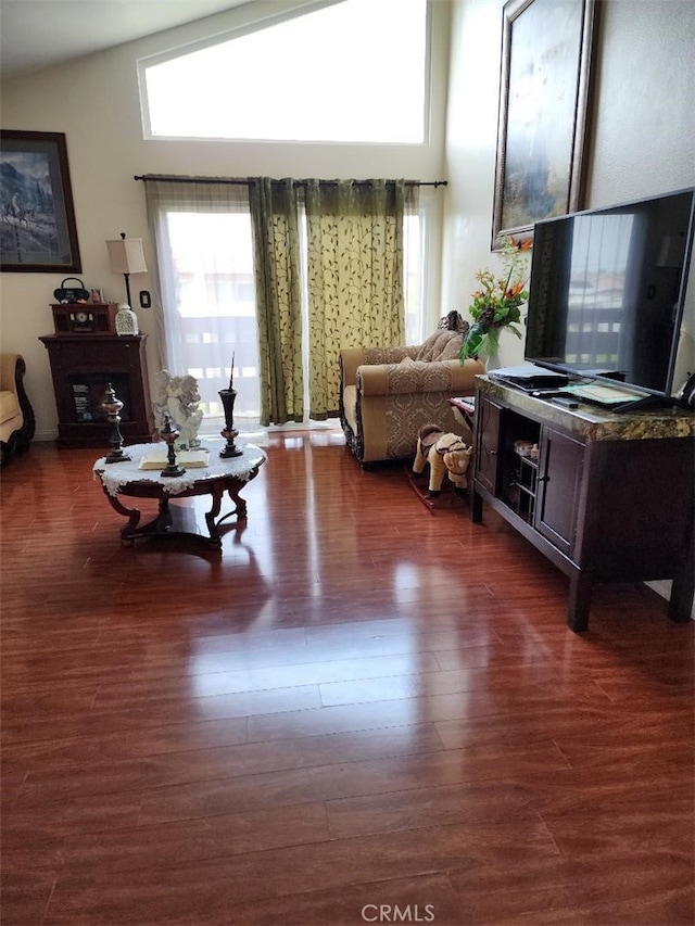 15116 S Raymond Ave Unit 104, Gardena, CA 90247 - living room featuring plenty of natural light and dark wood finished floors