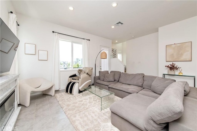251 Sash, Irvine, CA 92618 - living area with recessed lighting, light tile patterned floors, and a fireplace
