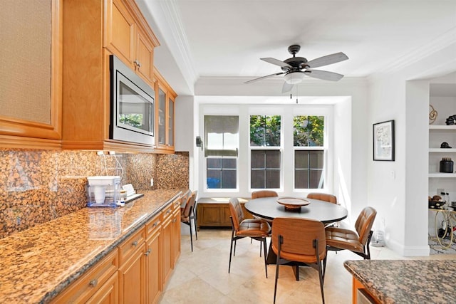 2814 Rambling Vista Rd, Chula Vista, CA 91915 - kitchen featuring stainless steel microwave, ornamental molding, tasteful backsplash, stone counters, and ceiling fan