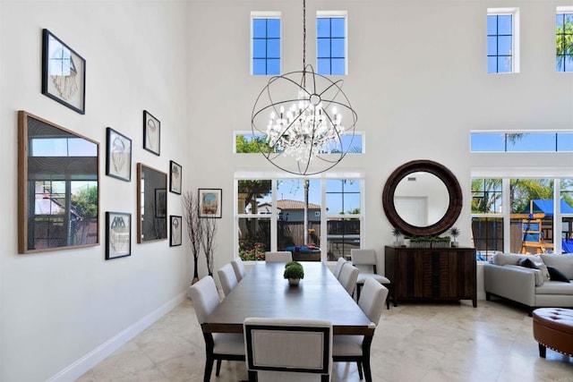 2814 Rambling Vista Rd, Chula Vista, CA 91915 - dining area featuring a high ceiling, a chandelier, and light tile patterned floors