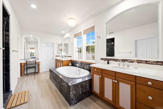 2814 Rambling Vista Rd, Chula Vista, CA 91915 - full bath featuring a bath, two vanities, plenty of natural light, wood finished floors, and recessed lighting