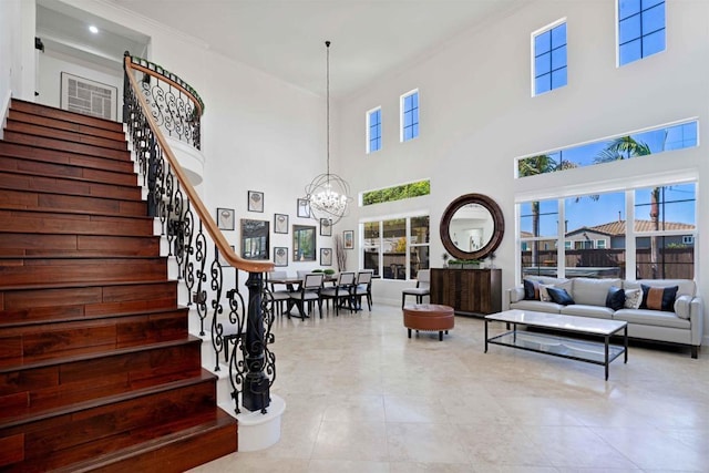 2814 Rambling Vista Rd, Chula Vista, CA 91915 - staircase with a chandelier, healthy amount of natural light, ornamental molding, a towering ceiling, and tile patterned floors