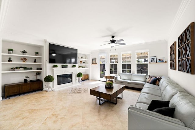 2814 Rambling Vista Rd, Chula Vista, CA 91915 - living area with ornamental molding, ceiling fan, built in features, a glass covered fireplace, and light tile patterned flooring