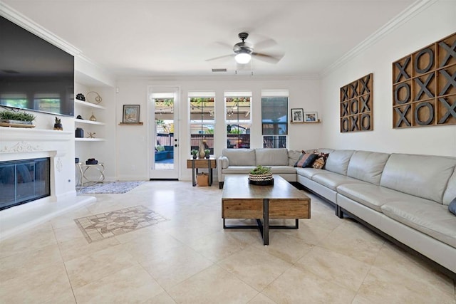 2814 Rambling Vista Rd, Chula Vista, CA 91915 - living room with crown molding, a ceiling fan, built in features, tile patterned flooring, and a glass covered fireplace