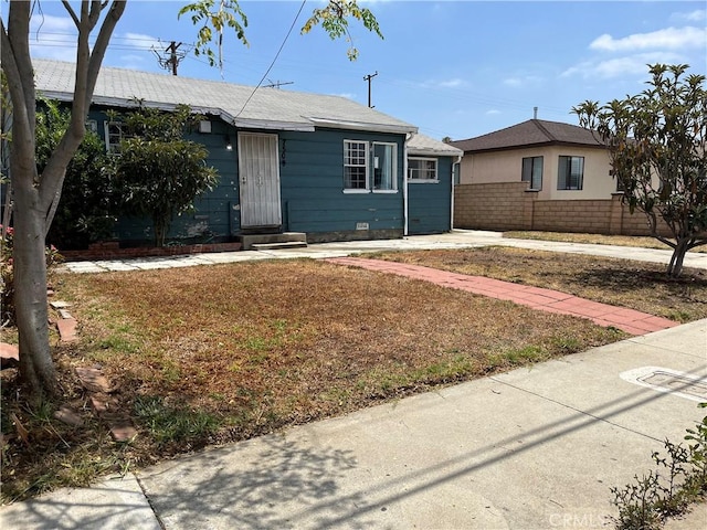 7509 Neenah St, Commerce, CA 90040 - view of front of house featuring entry steps and brick siding