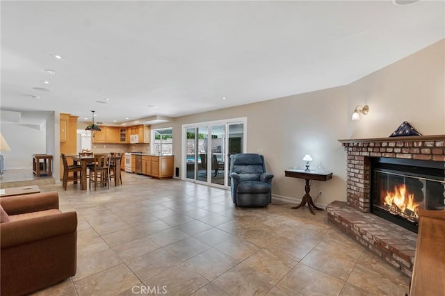 2146 N Brower St, Simi Valley, CA 93065 - living area with a fireplace, recessed lighting, light tile patterned floors, and french doors