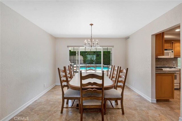 2146 N Brower St, Simi Valley, CA 93065 - dining space featuring a chandelier and a textured wall