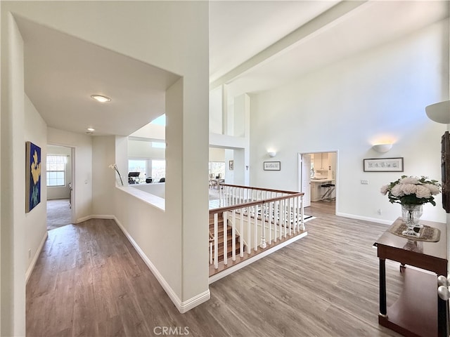21 Centaurus Unit 3, Irvine, CA 92603 - hallway with wood finished floors, an upstairs landing, and a high ceiling