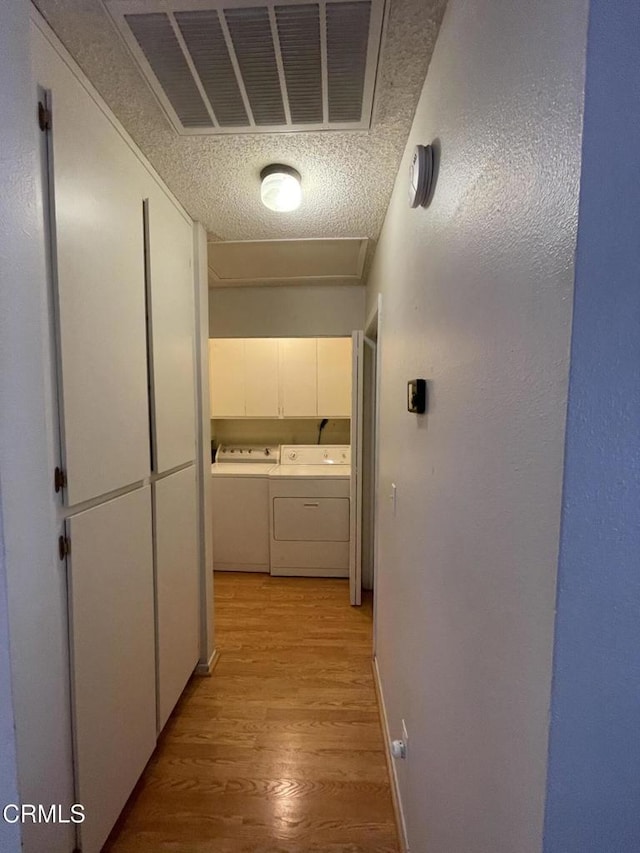 109 B St, Fillmore, CA 93015 - hallway with washing machine and clothes dryer and light wood finished floors