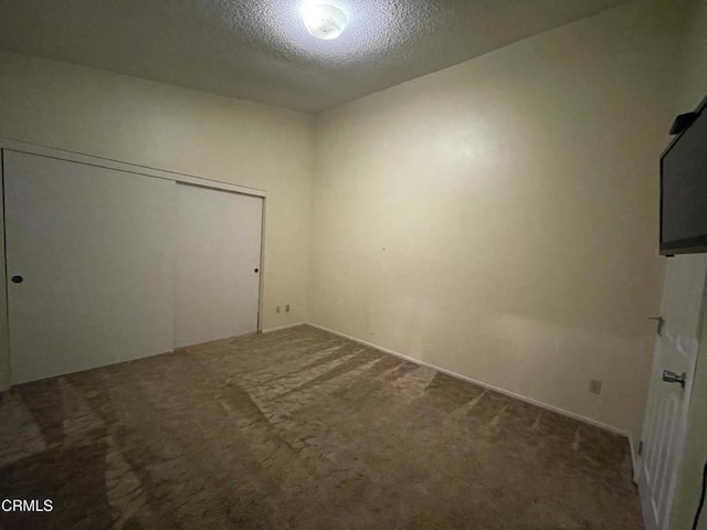 109 B St, Fillmore, CA 93015 - unfurnished bedroom with carpet floors, a textured ceiling, and a closet