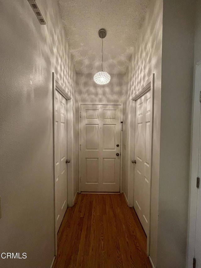 109 B St, Fillmore, CA 93015 - hall with wood finished floors and a textured ceiling