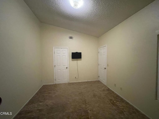 109 B St, Fillmore, CA 93015 - carpeted empty room with lofted ceiling and a textured ceiling
