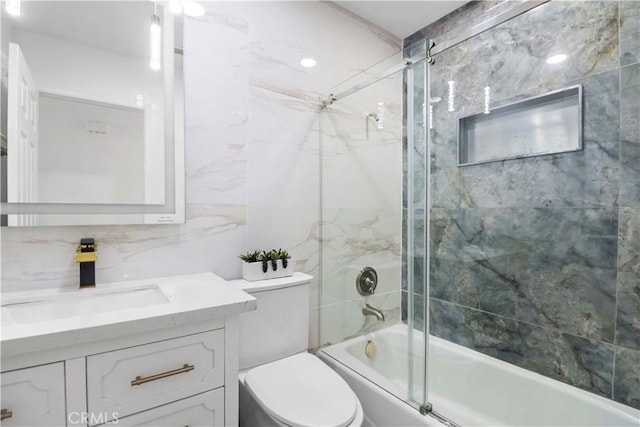 17824 Holmes Ave, Cerritos, CA 90703 - bathroom with tile walls, shower / bath combination with glass door, and vanity