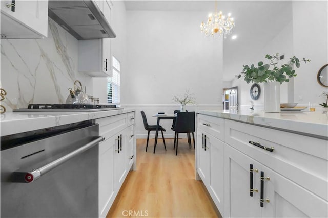 17824 Holmes Ave, Cerritos, CA 90703 - kitchen featuring stainless steel dishwasher, extractor fan, a chandelier, white cabinetry, and healthy amount of natural light