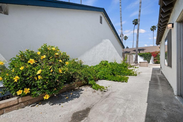 1310 Anza Ct, Oxnard, CA 93035 - view of side of home featuring stucco siding and a patio