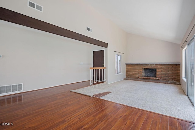 1310 Anza Ct, Oxnard, CA 93035 - unfurnished living room with wood finished floors, a brick fireplace, and high vaulted ceiling