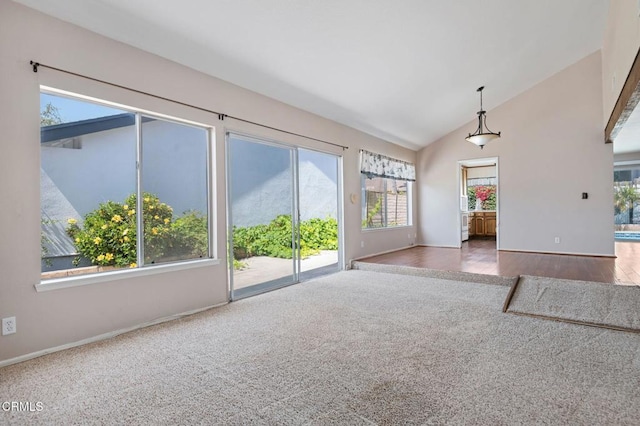 1310 Anza Ct, Oxnard, CA 93035 - unfurnished living room with healthy amount of natural light, lofted ceiling, and carpet flooring