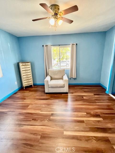 430 W 19th St, San Pedro, CA 90731 - living area with wood finished floors and ceiling fan