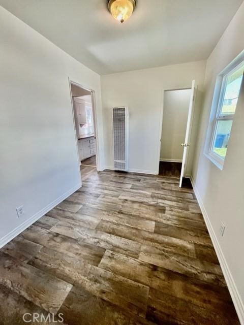 430 W 19th St, San Pedro, CA 90731 - unfurnished bedroom with a heating unit, wood finished floors, and ensuite bathroom