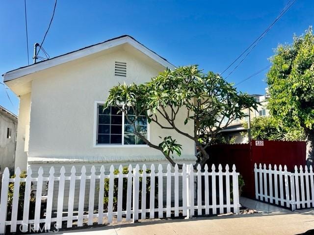430 W 19th St, San Pedro, CA 90731 - view of home's exterior with stucco siding and a fenced front yard