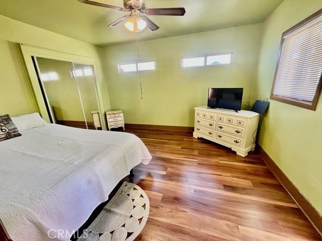 430 W 19th St, San Pedro, CA 90731 - bedroom featuring wood finished floors, a ceiling fan, and a closet