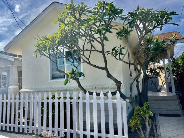 430 W 19th St, San Pedro, CA 90731 - view of property exterior featuring stucco siding and a fenced front yard