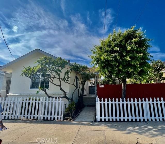 430 W 19th St, San Pedro, CA 90731 - view of property hidden behind natural elements featuring a fenced front yard