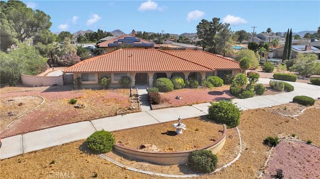 19996 Eyota Rd, Apple Valley, CA 92308 - mediterranean / spanish house featuring a tiled roof, stucco siding, and a residential view