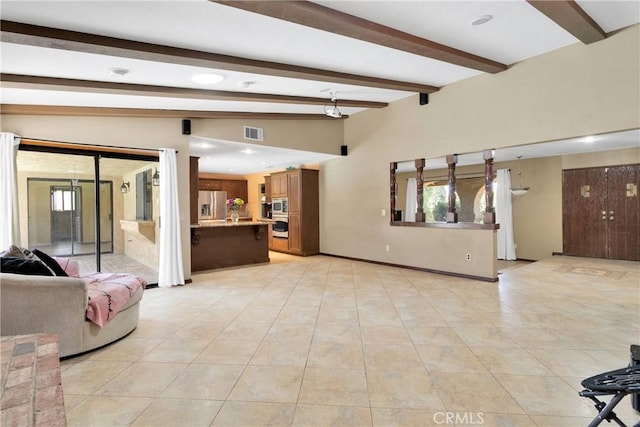 19996 Eyota Rd, Apple Valley, CA 92308 - unfurnished living room with beamed ceiling, light tile patterned floors, plenty of natural light, and recessed lighting