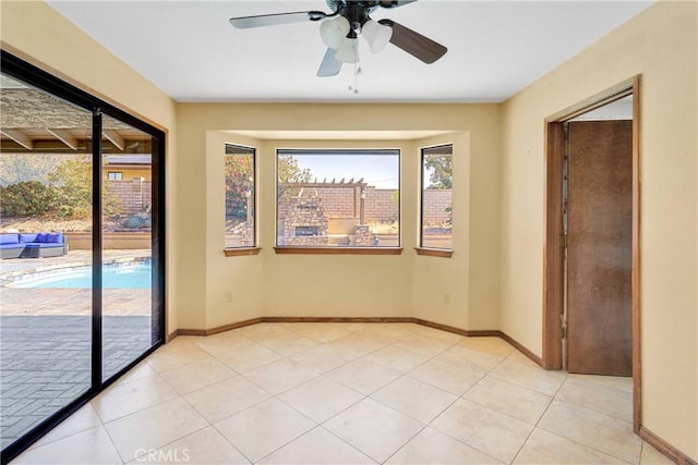 19996 Eyota Rd, Apple Valley, CA 92308 - spare room with a ceiling fan and light tile patterned floors