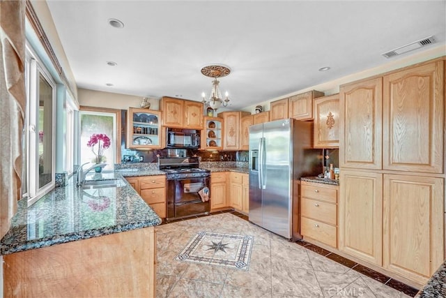 3486 Santa Clara Cir, Costa Mesa, CA 92626 - kitchen featuring black appliances, light brown cabinetry, a chandelier, dark stone counters, and glass insert cabinets