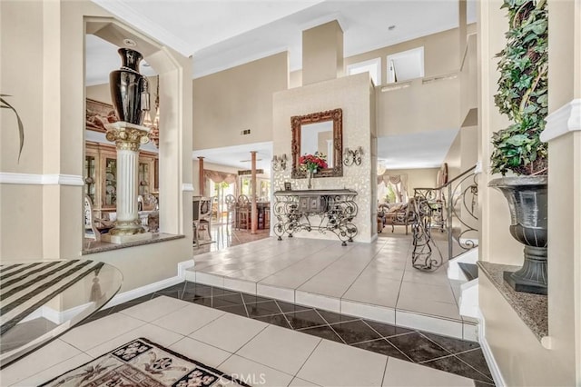 3486 Santa Clara Cir, Costa Mesa, CA 92626 - tiled foyer entrance featuring a high ceiling and decorative columns