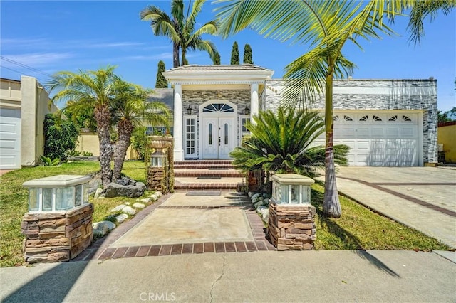 3486 Santa Clara Cir, Costa Mesa, CA 92626 - view of front of property with driveway, an attached garage, and stone siding