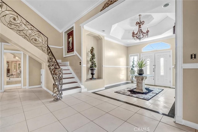 3486 Santa Clara Cir, Costa Mesa, CA 92626 - tiled foyer entrance with a chandelier, stairway, ornamental molding, and a tray ceiling