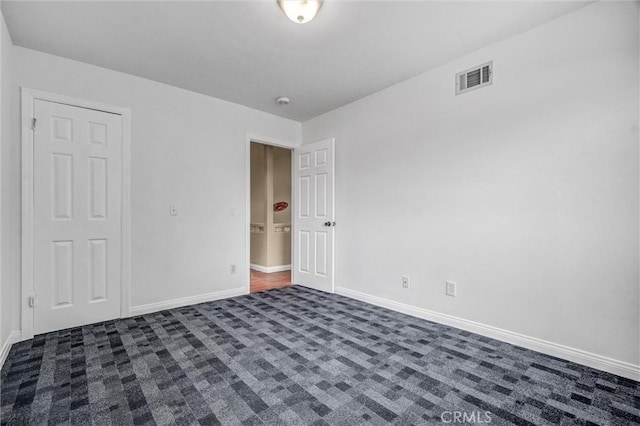 3486 Santa Clara Cir, Costa Mesa, CA 92626 - unfurnished bedroom featuring dark colored carpet and baseboards