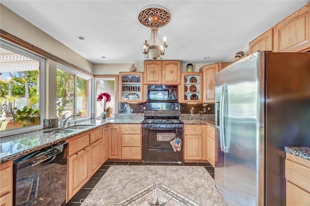 3486 Santa Clara Cir, Costa Mesa, CA 92626 - kitchen with black appliances, light brown cabinets, glass insert cabinets, and stone counters