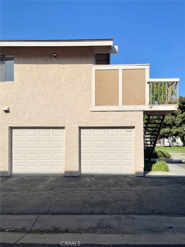 1850 Pritchard Way, Hacienda Heights, CA 91745 - view of front of property featuring stucco siding, driveway, an attached garage, and stairs